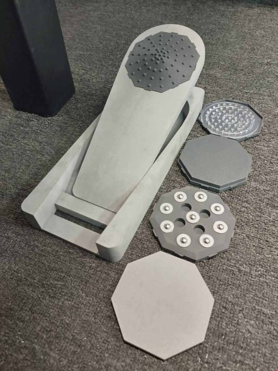 Con-Sole prototype pedal with four swappable octagonal Focus Pads laid out beside it